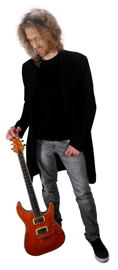 Mike Pearson holding a guitar