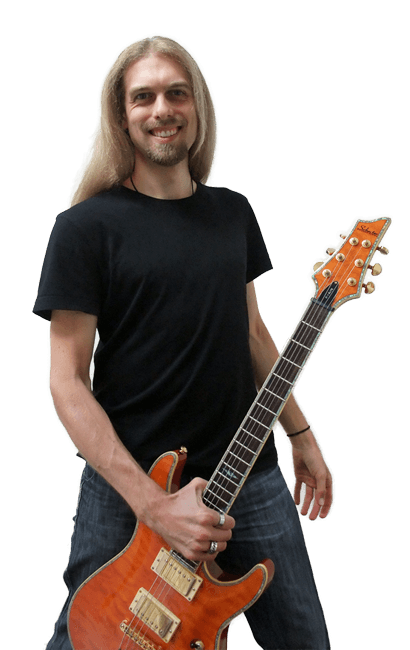 Mike Pearson holding a guitar