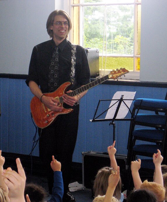 Mike playing at a school concert